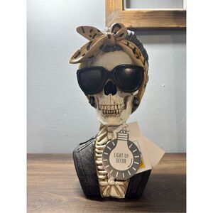 Skeleton bust wearing shades and leopard headband light up earrings Halloween de